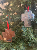 Hand punched tin ornaments: one natural and one copper cross.