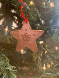 Hand punched tin ornament: copper star.
